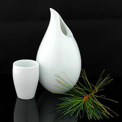 Dewdrop Sake Set / Vase  - The cool new Dewdrop Sake Set brings elegance and simplicity to the sake experience. It's crafted of luminous white Japanese porcelain molded into a unique dewdrop design and includes two tall slender sake cups to complete the set. - JLifeInternational.com