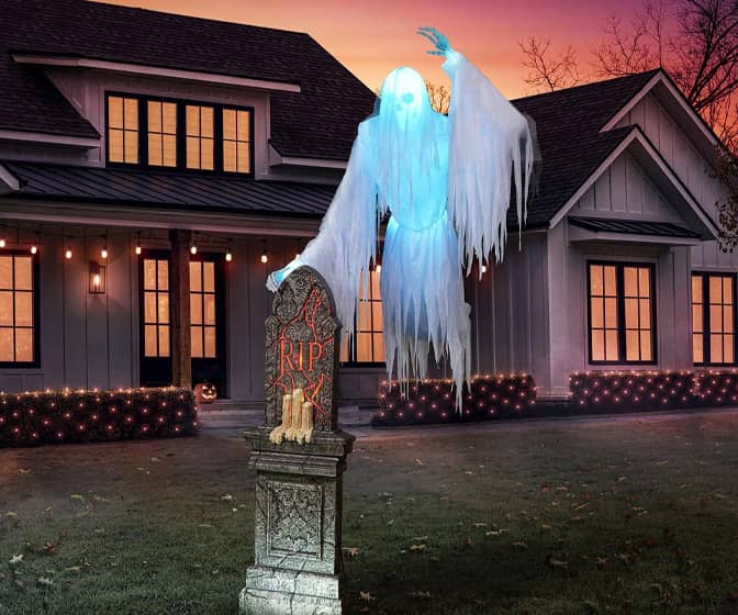 Gigantic Animated Skeleton Ghost Floating Around a Tombstone