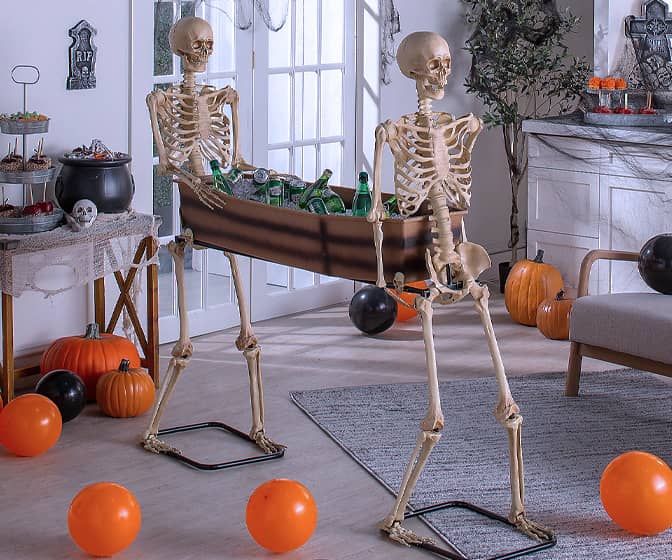 Lifesize Posable Skeletons Carrying a Coffin / Beverage Tub