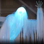 Gigantic Animated Skeleton Ghost Floating Around a Tombstone