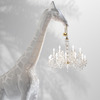 Life-Size Giraffe Statue Holding a Chandelier In Its Mouth