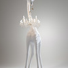 Life-Size Giraffe Statue Holding a Chandelier In Its Mouth