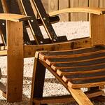Reclaimed Bourbon Barrel Adirondack Chairs with Footrests and a Table