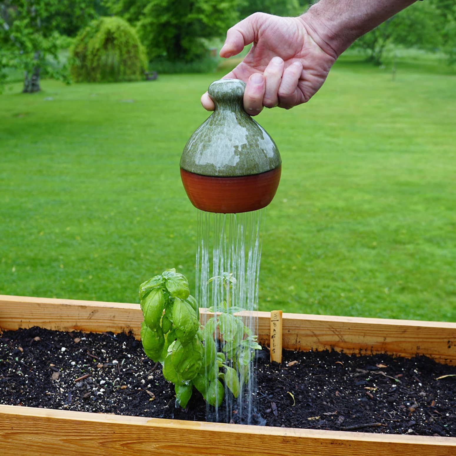 Thumb-Controlled Watering Can